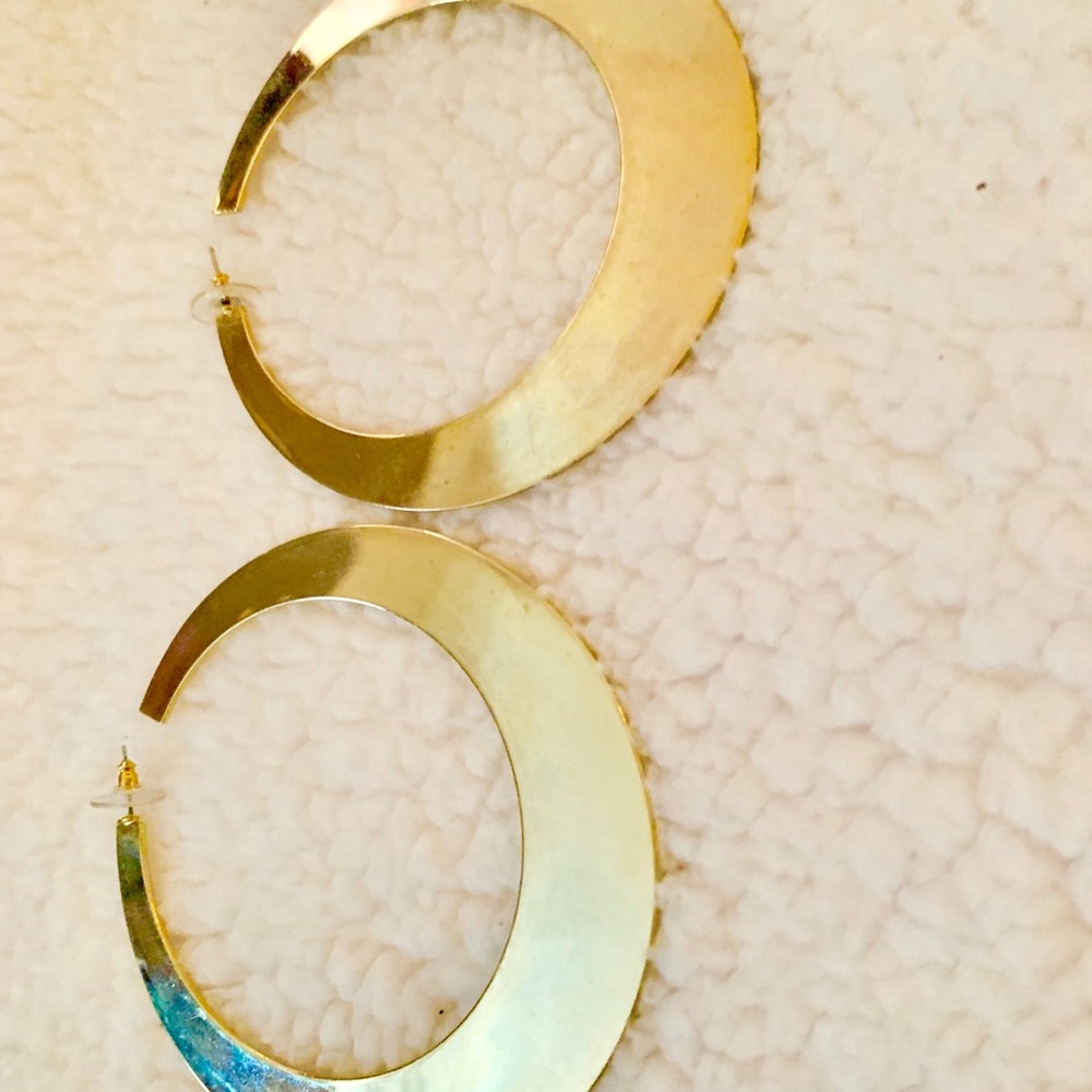 Large hoops gold color metal.